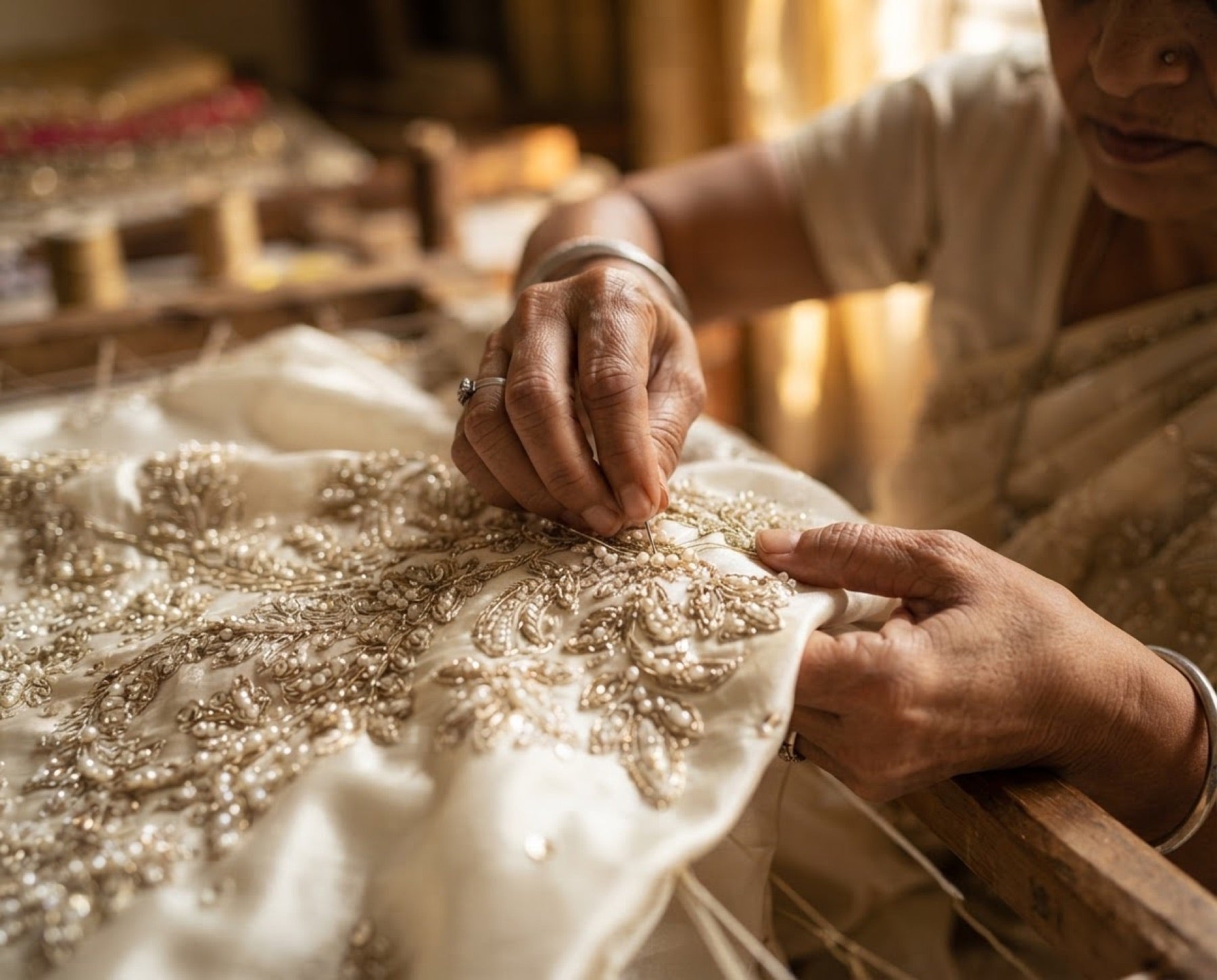 Artisan hands embroidering